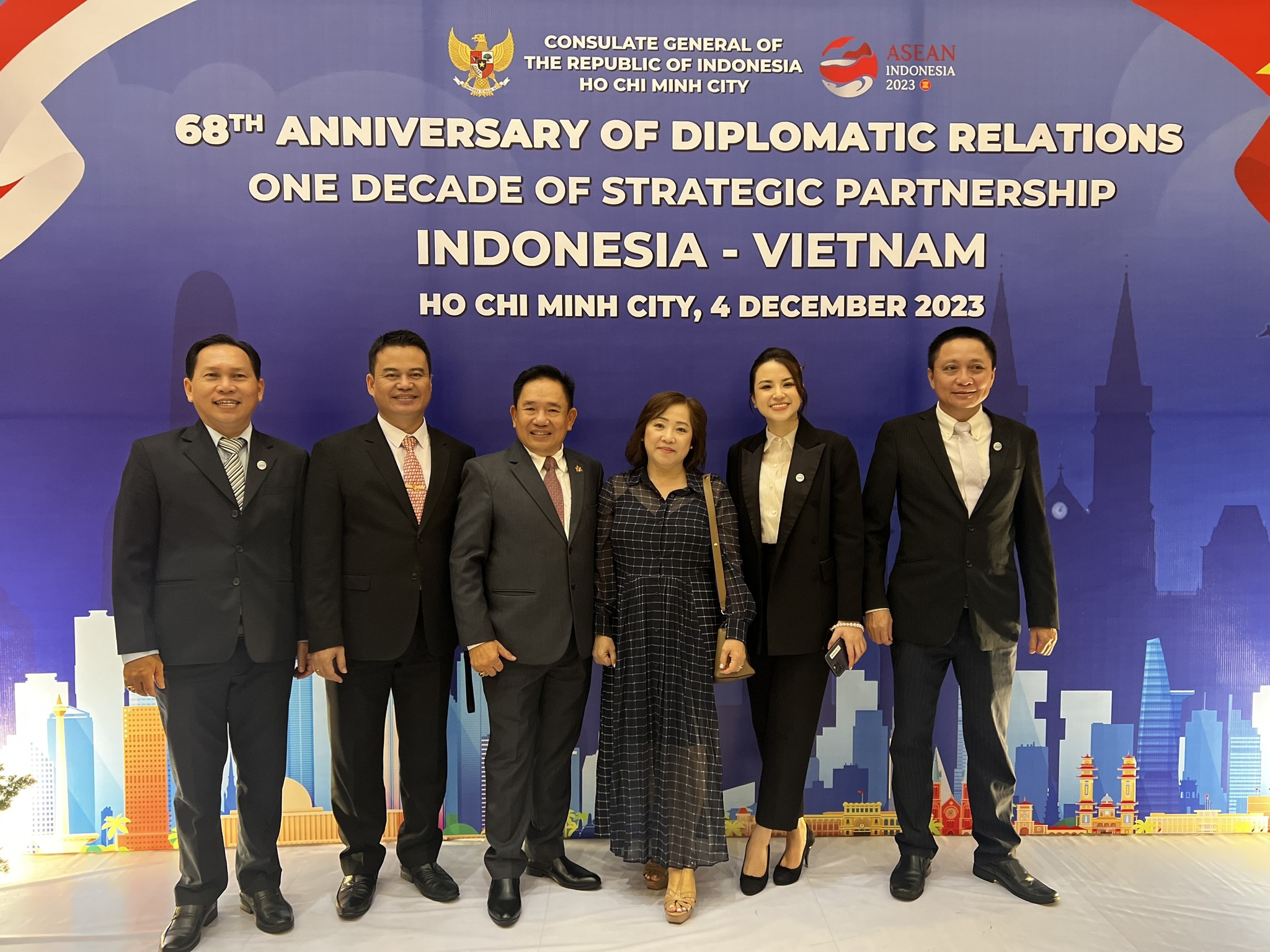 May be an image of 6 people, suit, dais and text that says 'INDONESIA 2023 CONSULATE GENERAL OF THE REPUBLIC INDONESIA CHI MINH CITY 68TH ANNIVERSARY OF DIPLOMATIC RELATIONS ONE DECADE OF STRATEGIC PARTNERSHIP INDONESIA VIETNAM Ho CHI MINH CITY, 4 DECEMBER 2023 កក'